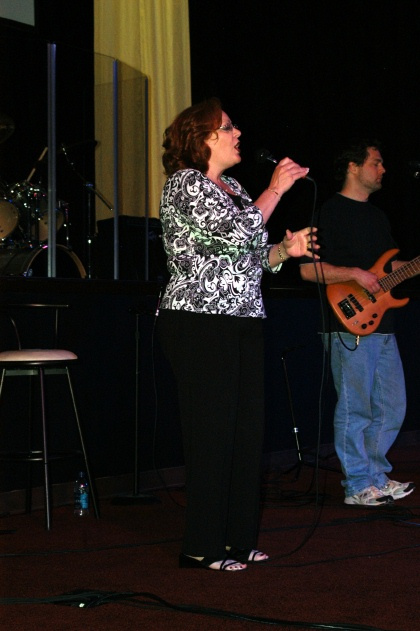Angela worshiping in concert